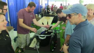 people sampling and talking about wine at a festival in cold spring new york