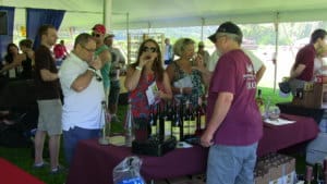 a group of people sampling wines in new york upstate